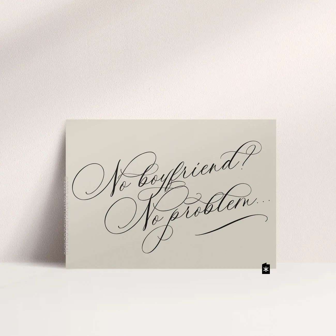 Greeting card that says "No Boyfriend, no problem" in script font.