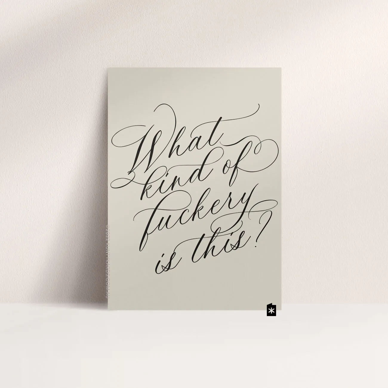 Grey card with black ink printed in script font on the front that says "What kind of fuckery is this?" made in Perth WA by Kunty Kards