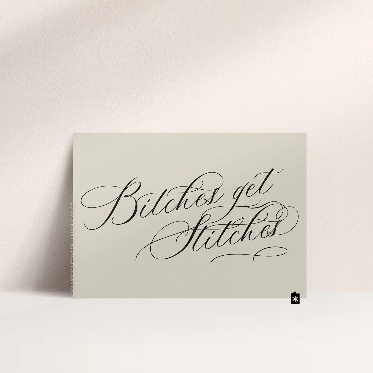 Misty grey engagement card with "Bitches get stitches" in black script font on the front made by Kunty Kards, Perth WA
